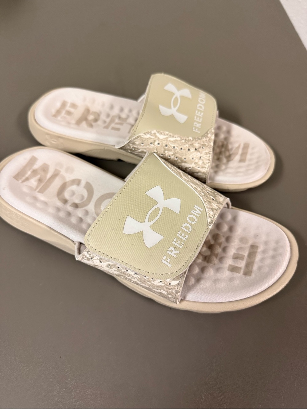 Under Armour women’s slides in Light Beige with White Logo